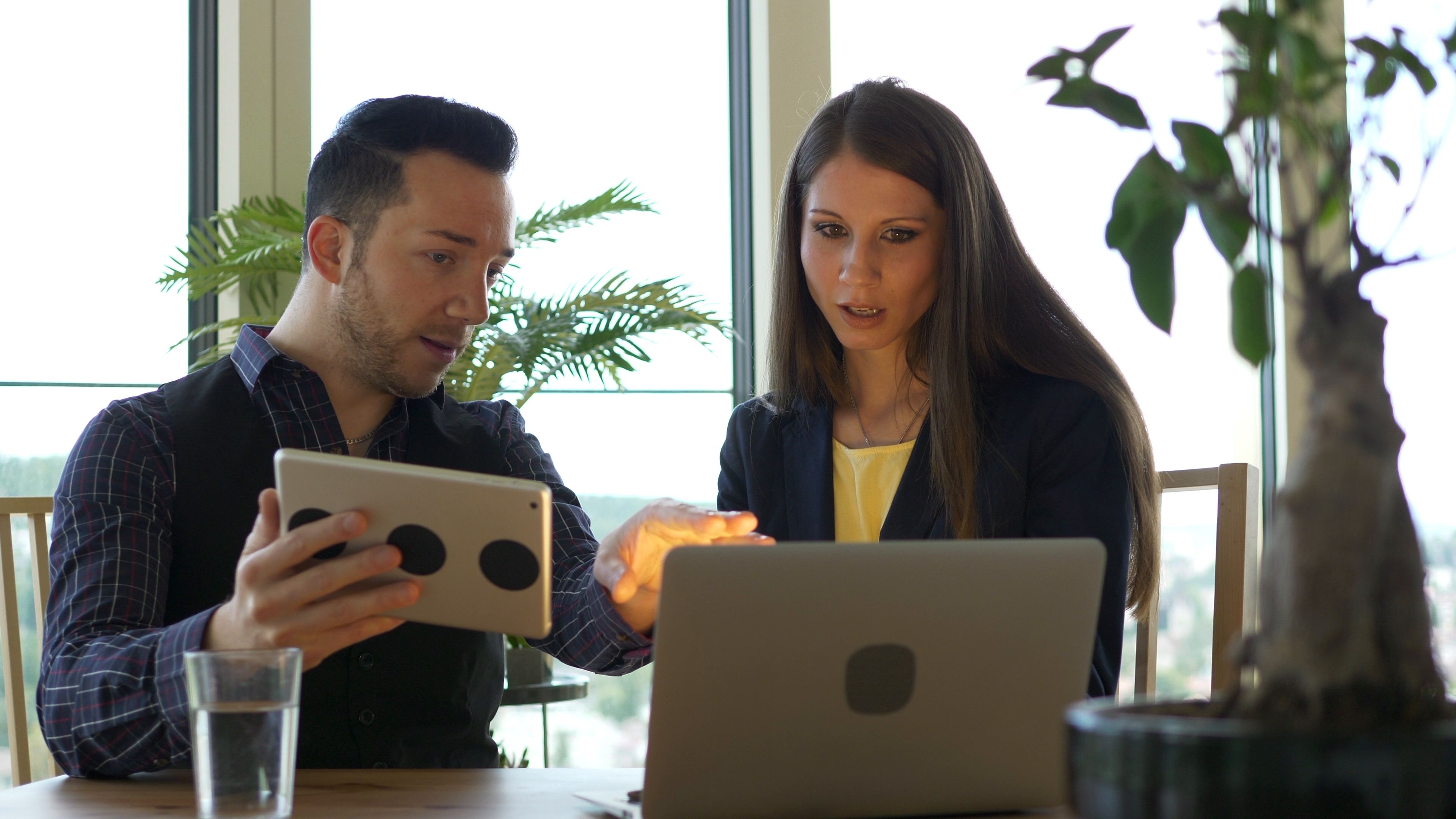 Two People Having A Corporate Business Meeting In Modern Office