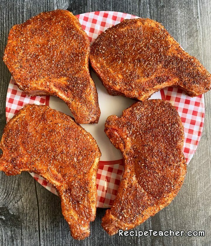 Thick, bone-in pork chops with a delicious seasoning rub, cooked to perfection on your grill. Bone In Pork Chop Recipe Grill, Grilled Pork Chops Rub, Grilled Pork Chop Seasoning, Grilling Thick Pork Chops, Pork Chops Bone In, Smoked Pork Chops, Easy Pork Chops, Boneless Pork Chops, Pork Chops On Grill