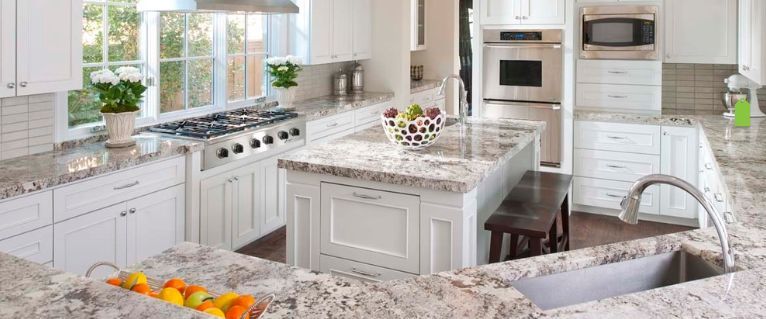 this is the alaska granite pattern paired with white cabinets in the