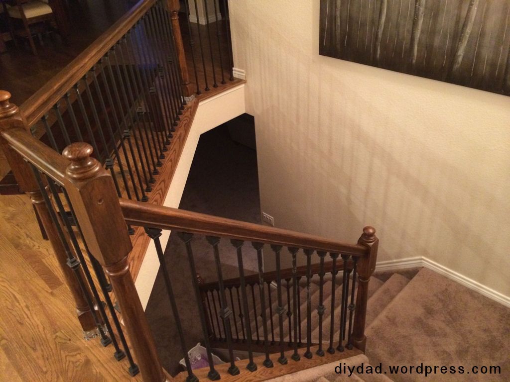 We recently had a dishwasher leak in our kitchen that necessitated the wood floors being patched and re-finished. We had always wanted to extend the wood floors through our entry and into the dini… Wood Balusters, Wood Railing, Railing Design, Handrail, Diy Stair Railing, Wrought Iron Stair Railing, Staircase Remodel, Staircase Ideas, Diy Stairs Makeover