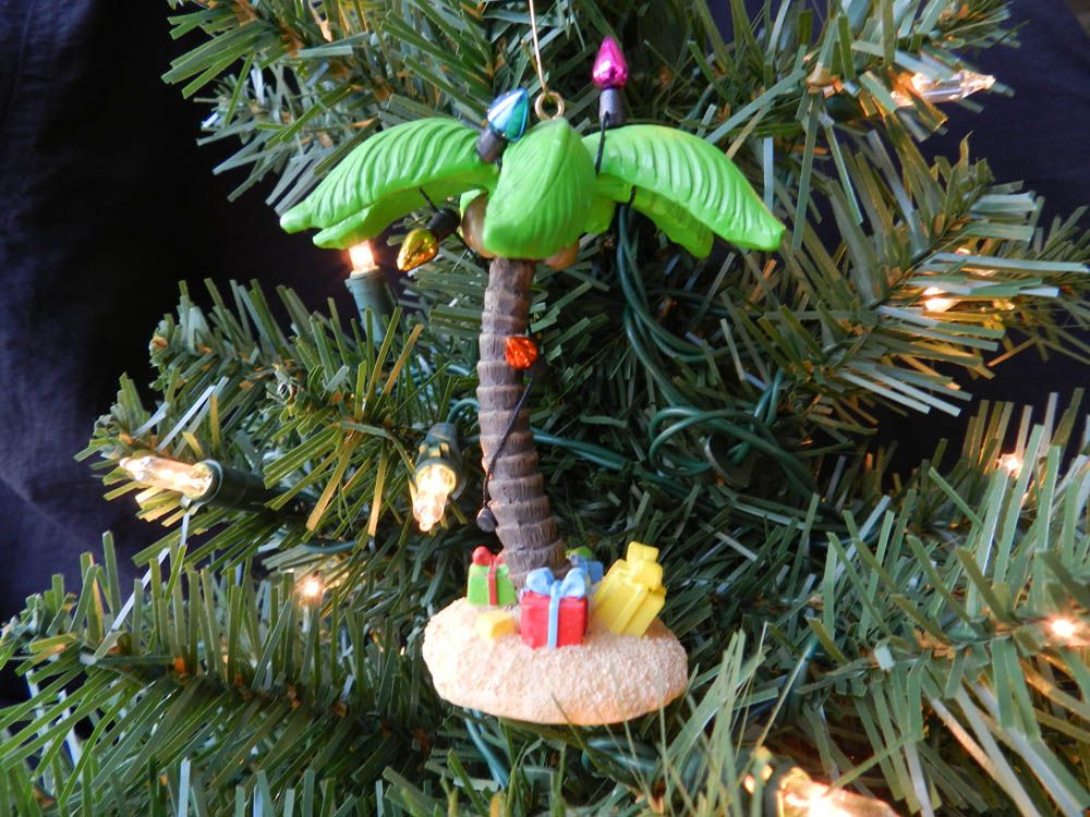 this christmas ornament features a palm tree that is decorated with palm tree christmas ornament