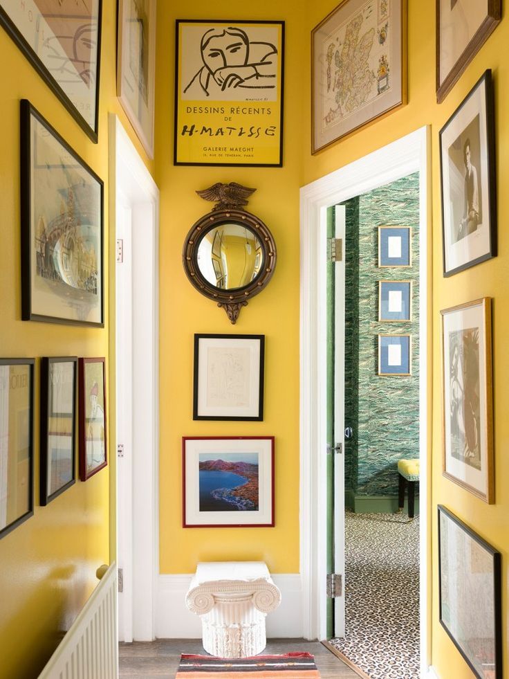 inside Luke Edward Hall's maximalist London apartment: yellow hallway / gallery wall hallway ideas Yellow Hallway, Hallway Colours, Yellow Room, Dark Hallway Paint Colors, Bright Hallway Ideas, Yellow Wall Decor, Mustard Yellow Walls, Hallway Decorating, Interior Decorating