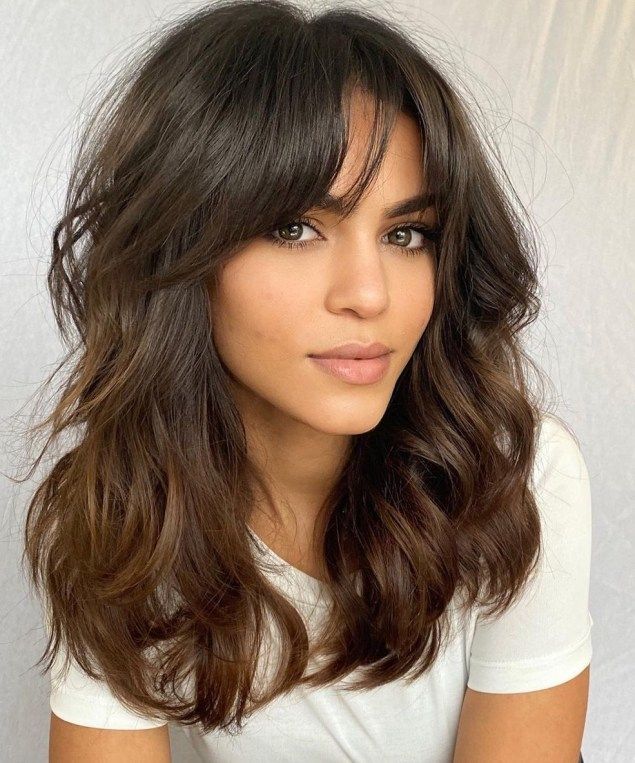9. Curtain Bangs for Long Hair. Beautiful curtain bangs transitioning into longer layers belong to our favorite wavy hairstyles due to their simplicity and effortless chic. This styling option seems to be made for thick unruly hair! Long Layered Hair, Long Hair Cuts, Long Bob Wavy Hair, Haircut Thick Wavy Hair, Shoulder Length Hair Cuts With Layers, Thick Wavy Haircuts, Haircut Bangs, Long Bob With Bangs, Layered Hair With Bangs