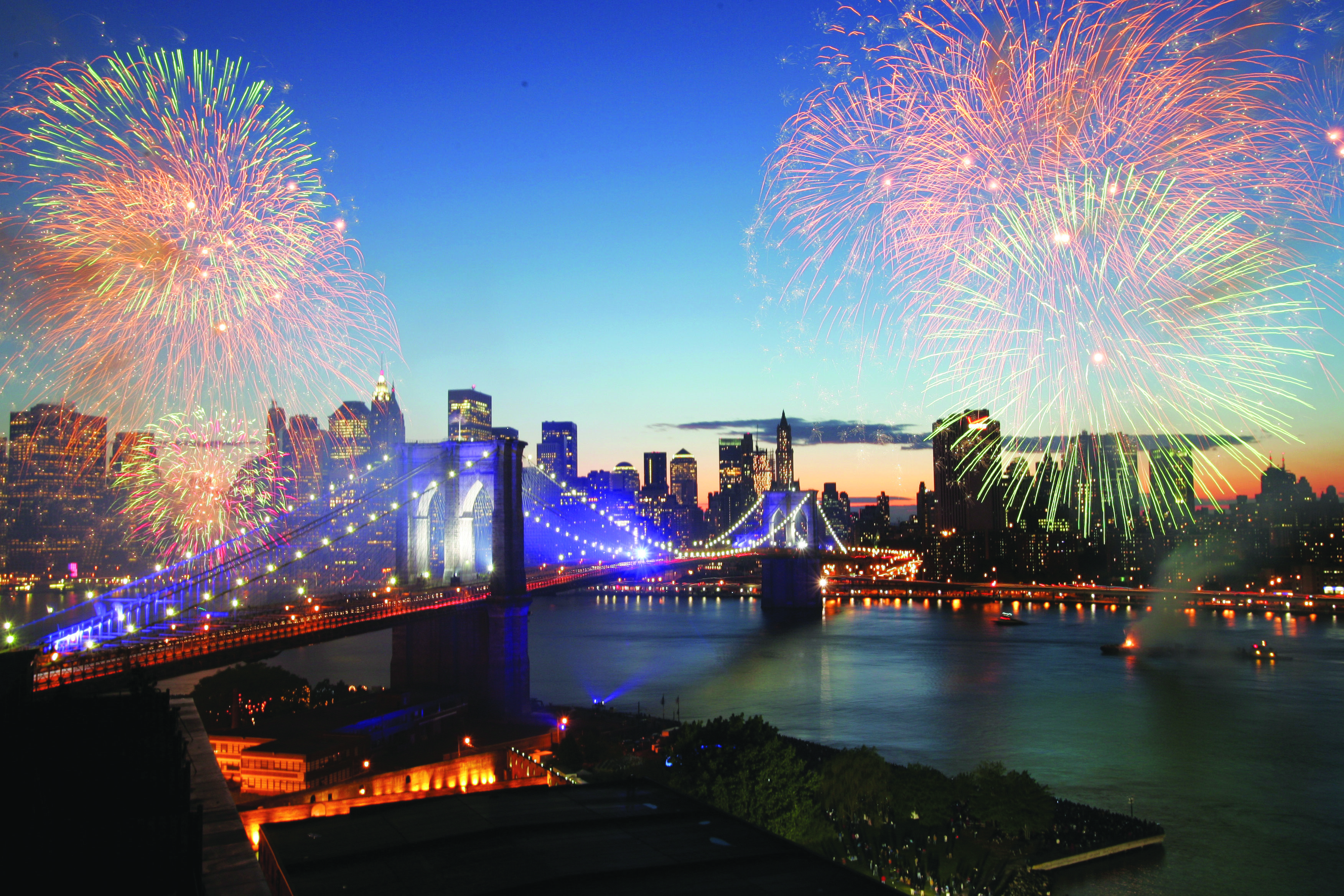 Fireworks light up the Brooklyn Bridge during its 125th birthday in