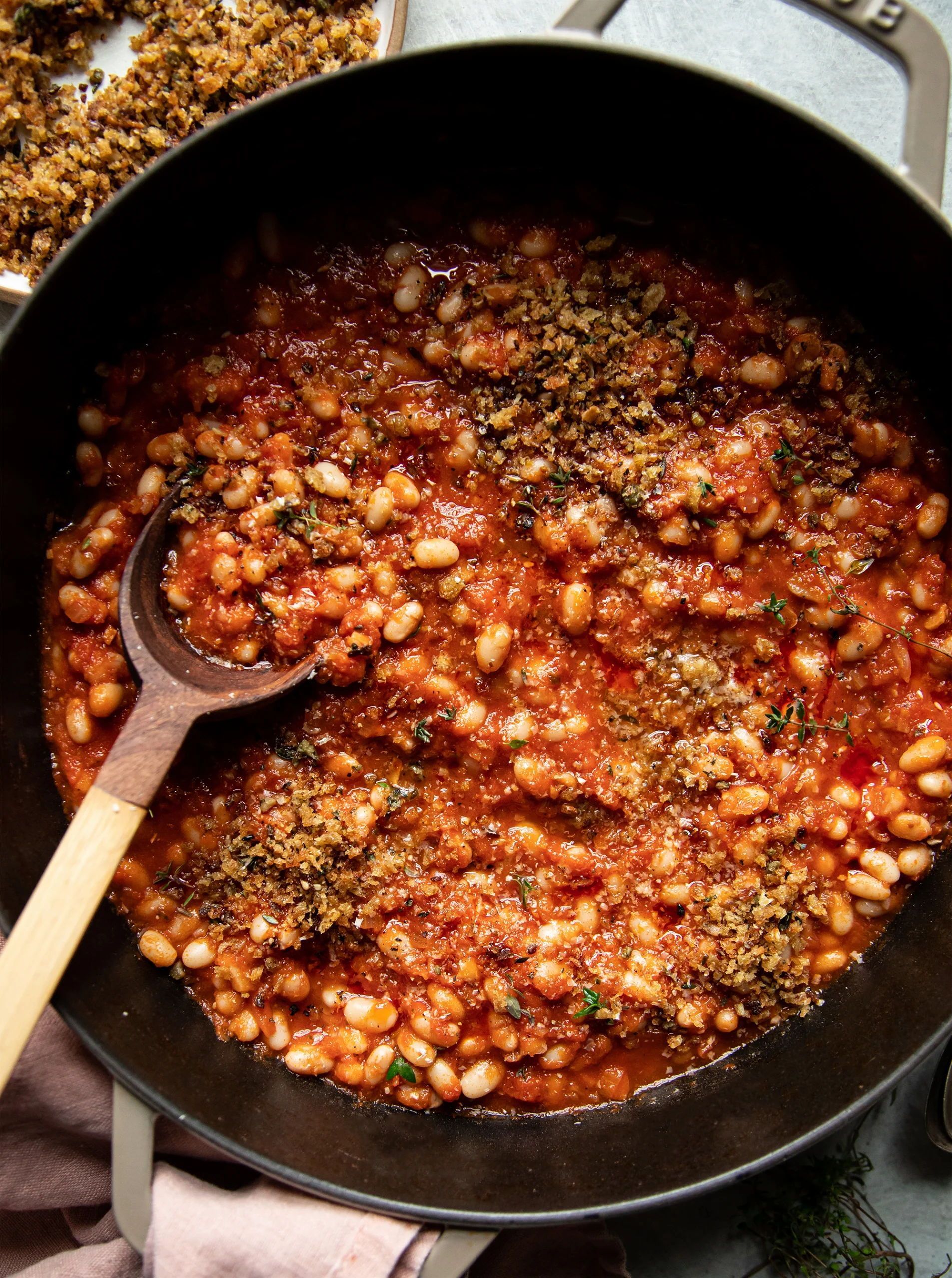 Jammy sun dried tomato white beans with crispy caper breadcrumbs is a flavourful and simple vegan main course made with pantry ingredients. This vegan dinner recipe comes together in about 40 minutes and is simple to prepare. Quick Vegan Dinner Recipes, Vegan Gluten Free Dinner, Vegan Recipes, Simple Recipes, Vegan Meals, Dried Tomatoes, Sun Dried Tomato, White Bean Recipes, Vegan Main Course