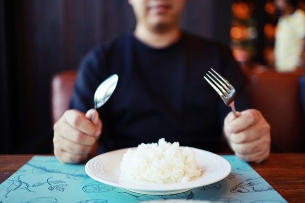 Premium Photo Man Eating Rice Enjoying A Meal In Restaurant Em 2024 premium-photo-man-eating-rice-enjoying-a-meal-in-restaurant-em-2024