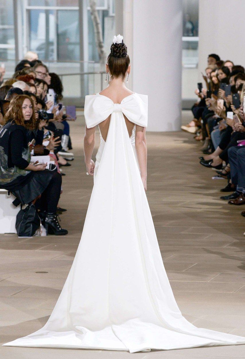wedding dress with huge bow on back