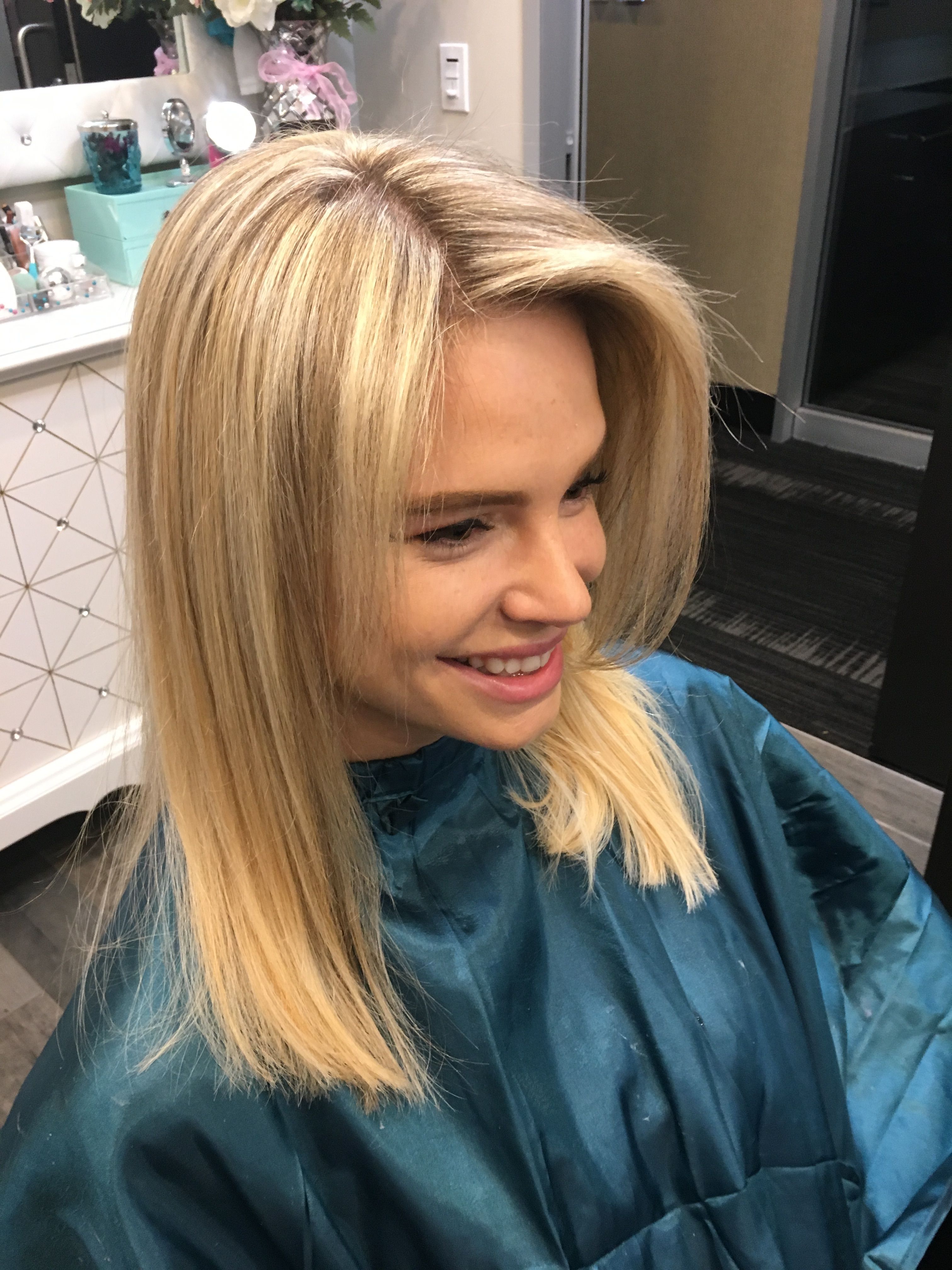 Pale highlights on this blonde brightened her look