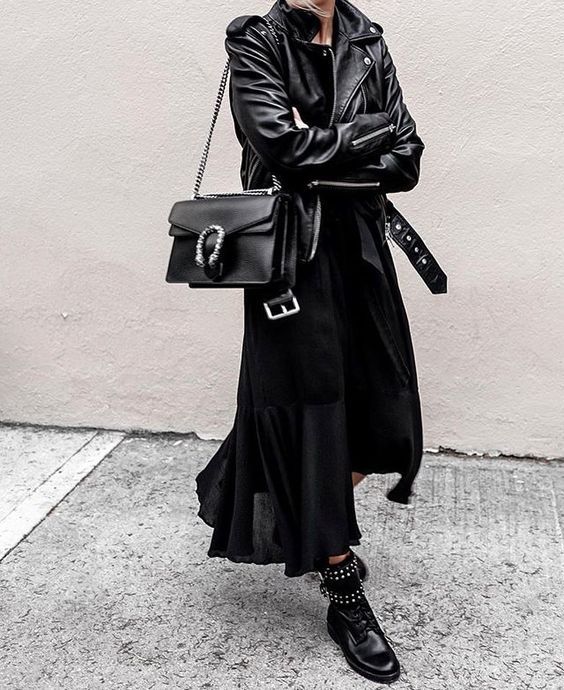 all black outfit ideas: black maxi dress, black leather moto jacket, combat boots, street style