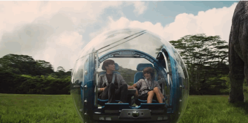 You can take a spin in a super-cool "gyrosphere" next to a lumbering brachiosaurus. | Jurassic world trailer, New jurassic world, Jurassic world movie