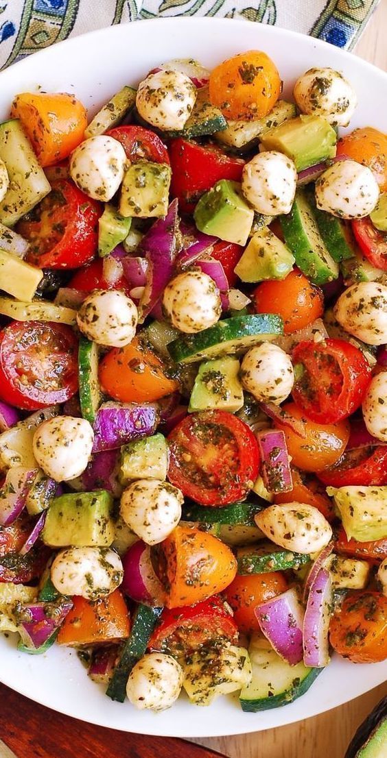 Tomato Cucumber Salad with Avocado, Mozzarella, and Basil Pesto