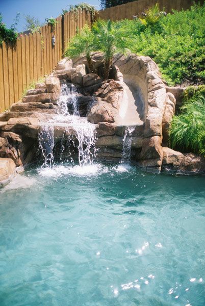 Waterfall Pool Slide And Cave Under Waterfall Shoulda Done This When We Had The Pool Built Waterfalls Backyard Pool Landscaping Backyard Pool