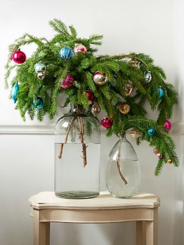 Evergreen Branches With Ornaments In Oversize Jars And Vases A Good Alternative To Mini Small Christmas Trees Alternative Christmas Tree Christmas Decorations