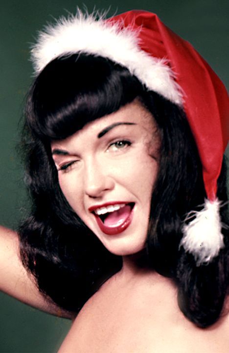the ultimate pin up gal in the 50s betty page christmas pose betty page christmas