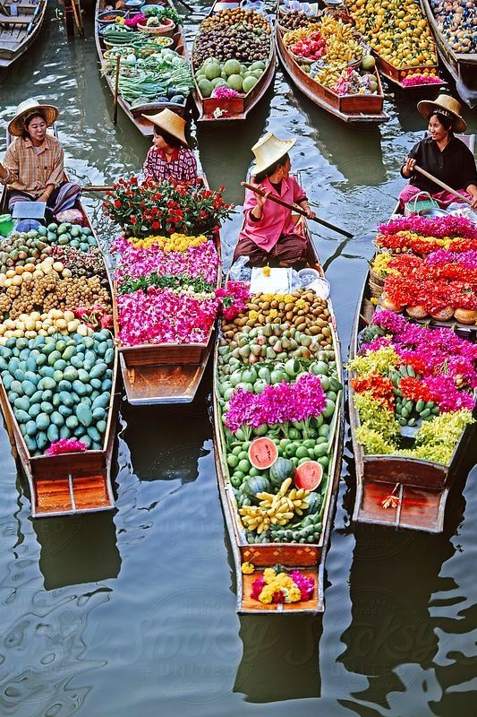 Women Market Traders In Boats Laden With Fruit And Flowers, Damnoen Saduak Floating Market, Bangkok, Thailand, Southeast Asia, Asia by Stocksy Contributor Gavin Hellier