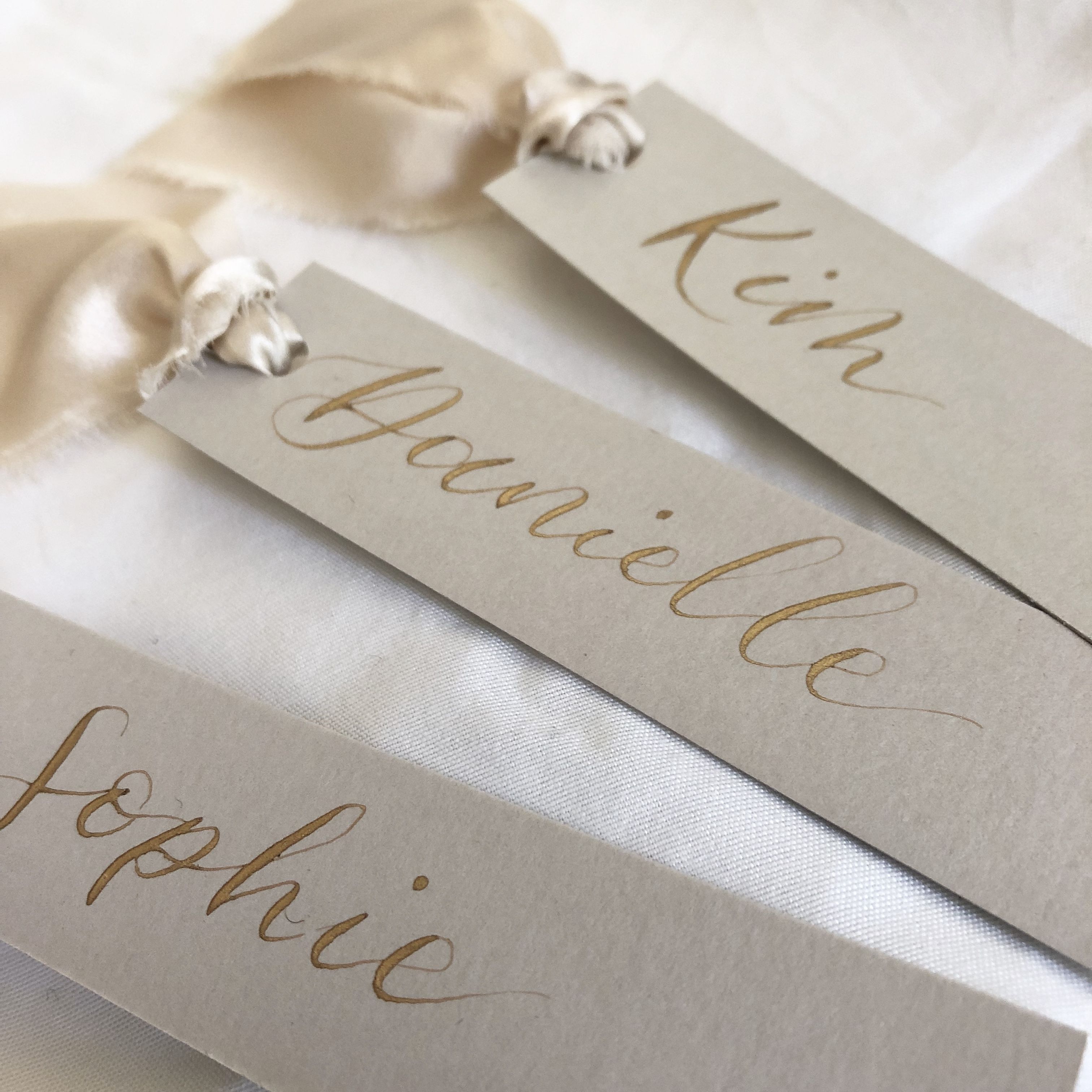 place cards silk ribbon gold ink wedding stationery