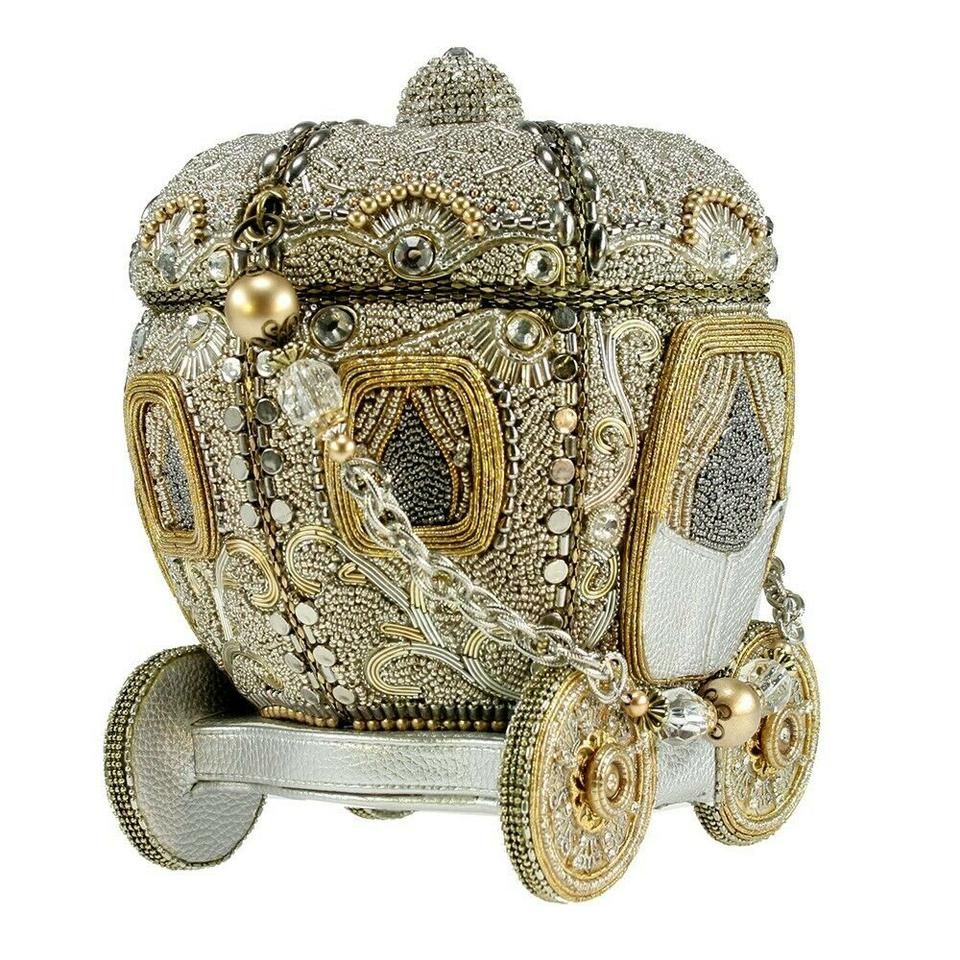 MARY FRANCES Ships TODAY MARY FRANCES Before Midnight Carriage Bag Handbag Beaded Gold Silver NEW Especially Made JUST FOR US FOR YOU Limited edition and Limited Quantity. Before Midnight Handbag Once upon a time there was a beautiful pumpkin that dreamed of becoming a carriage. . . Dreams come true. Any princess would love to wear this extensively hand beaded bejeweled version of the classic Cinderella coach. W x D x H: 6 x 6 x 7 " Strap Length End to End: 14" Drop Length 7"Large opening , insi Mary Frances Purses, Mary Frances Handbags, Coach Purses, Coach Handbags, Purses And Handbags, Women Handbags, Novelty Handbags, Novelty Bags, Vintage Purses