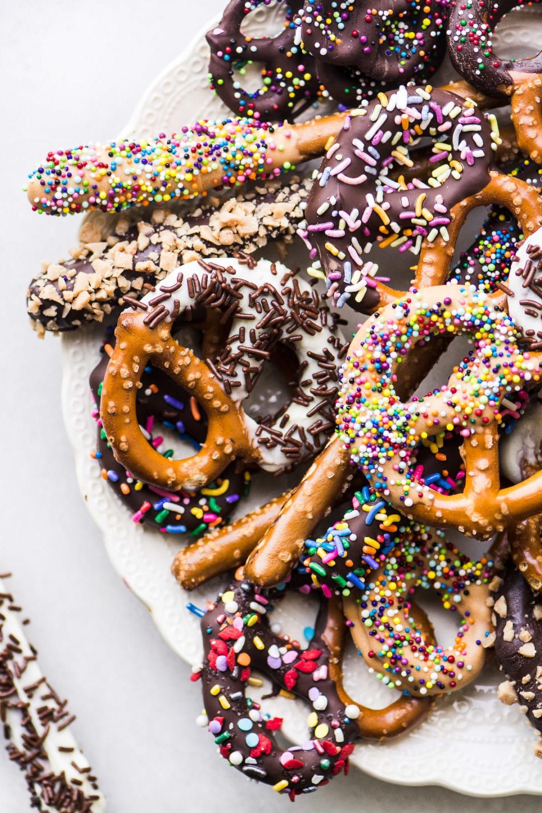 chocolate covered pretzels on a white plate | Pretzel dip, Chocolate