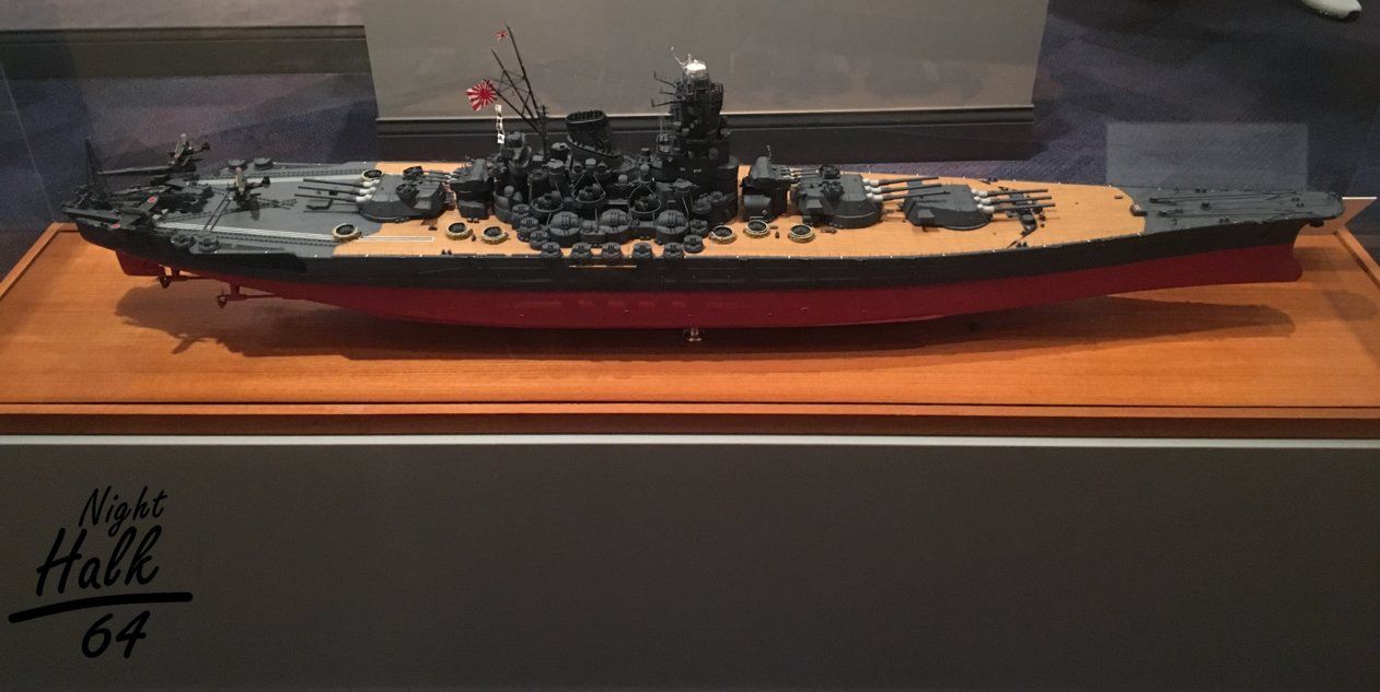 a model ship on display in a glass case