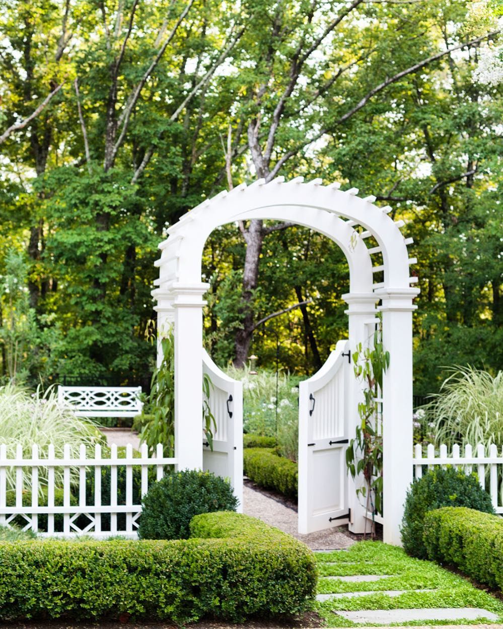 a graceful gated archway offers entree into this formal perennial garden the lush backyard was the vision of l garden gate design garden entrance garden gates gated arbor trellis on a graceful gated archway offers entree into this formal perennial garden the lush backyard was the vision of l garden gate design garden entrance garden gates pinterest