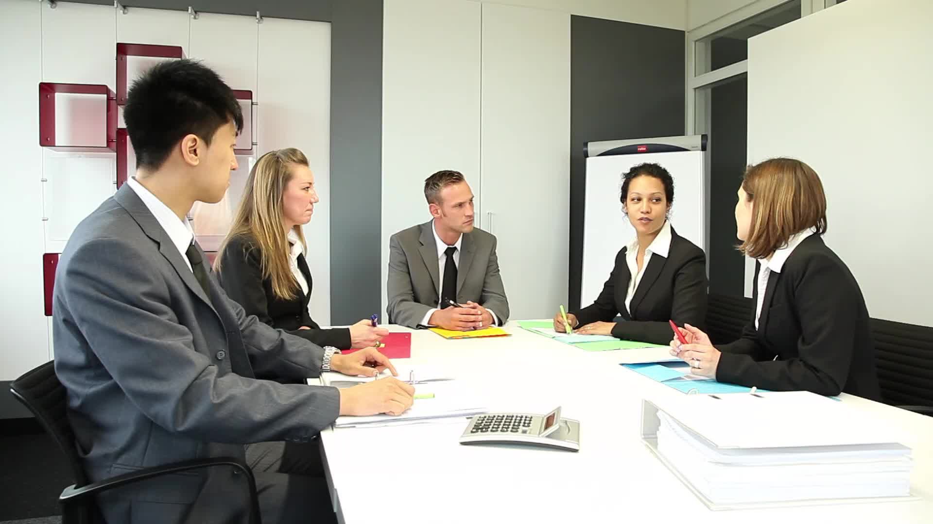 Five International People Having A Business Meeting In A