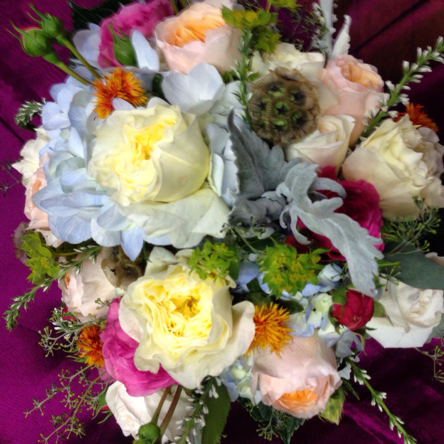David Austin garden roses stand out in this bridal bouquet Bridal