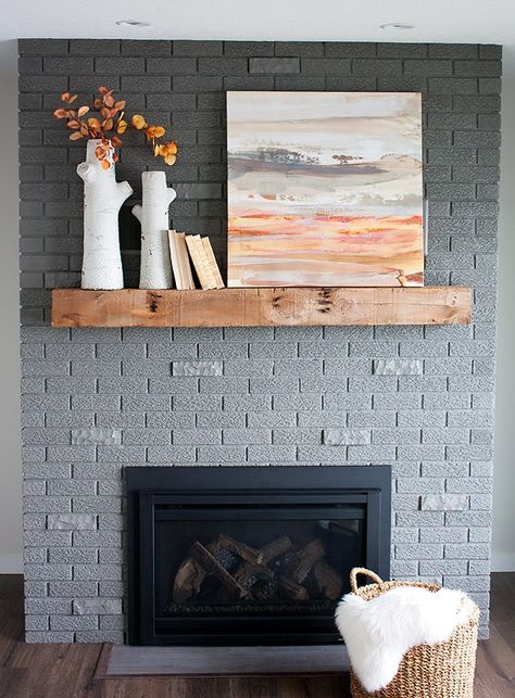 70's brick fireplace makeover. Amazing transformation - love the new SW gray paint color. Fireplace Fall Decor, Fireplace Update, Paint Fireplace, Brick Fireplace Makeover, Home Fireplace, Fireplace Remodel, Living Room With Fireplace, Fireplace Mantels, Fireplace Ideas