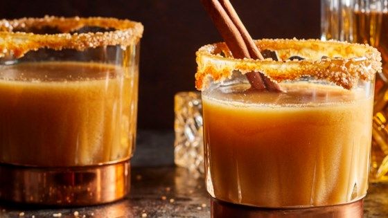 Spiced rum and caramel topping bring new life to apple cider, making this the perfect nightcap for those chilly fall evenings. #spikedapplecider