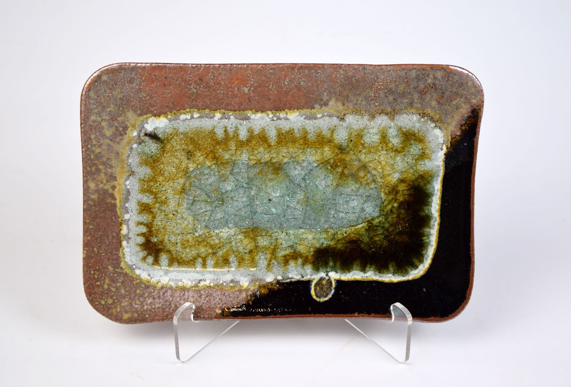 All of our items are handmade and one of a kind! Variation is a normal part of the handmade pottery process, and variations from the sample image should be expected. Please contact us with any questions. This lovely and vibrant tray is made by hand, and one of a kind. Produced by a fun group of artists in Minneapolis MN just for you! Black and Copper and Geode Crackle Glass. Small tray measures approximately 9 x 6. Perfect as a stunning display piece or a serving plate for cheese and crackers, b Small Tray, Crackle Glass, Straight Edge, Serving Plates, Handmade Pottery, Geode, Fused Glass, Tea Lights, Fun Group