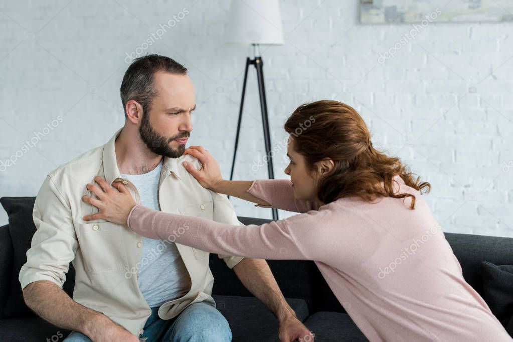 Angry Woman Pushing Handsome Bearded Man Home Stock Picture Ad