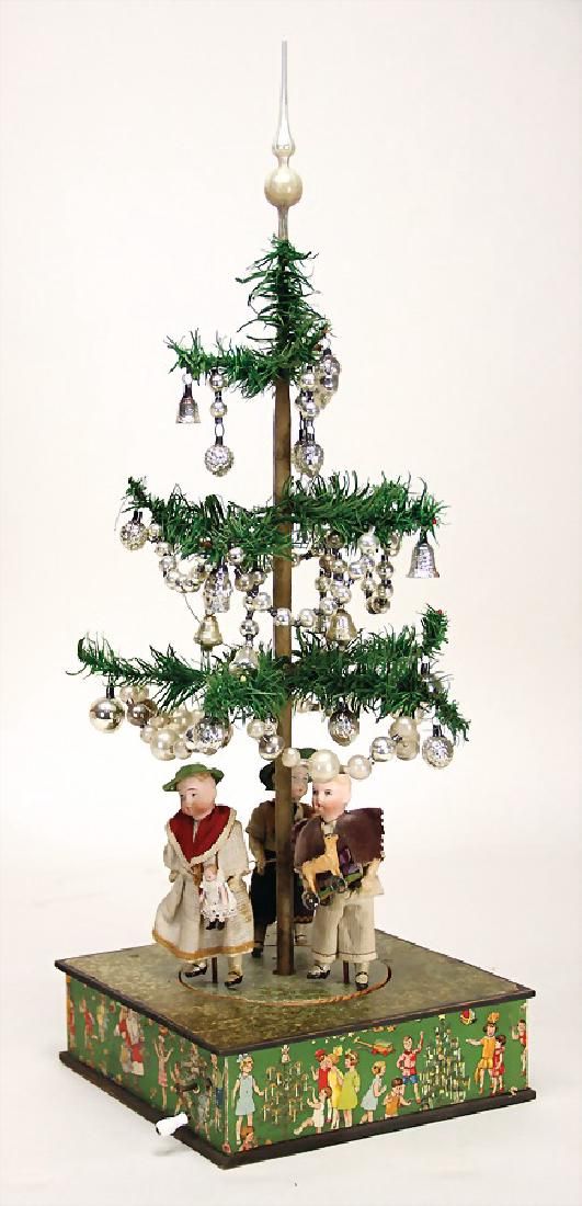 Unusual Christmas Tree Machine, Machine With Crank With On Antique Antique Feather Tree on a Musical Tree Stand. When the music plays the doll figures move in a dance. - Unusual Christmas Tree Machine, Machine With Crank With On Antique