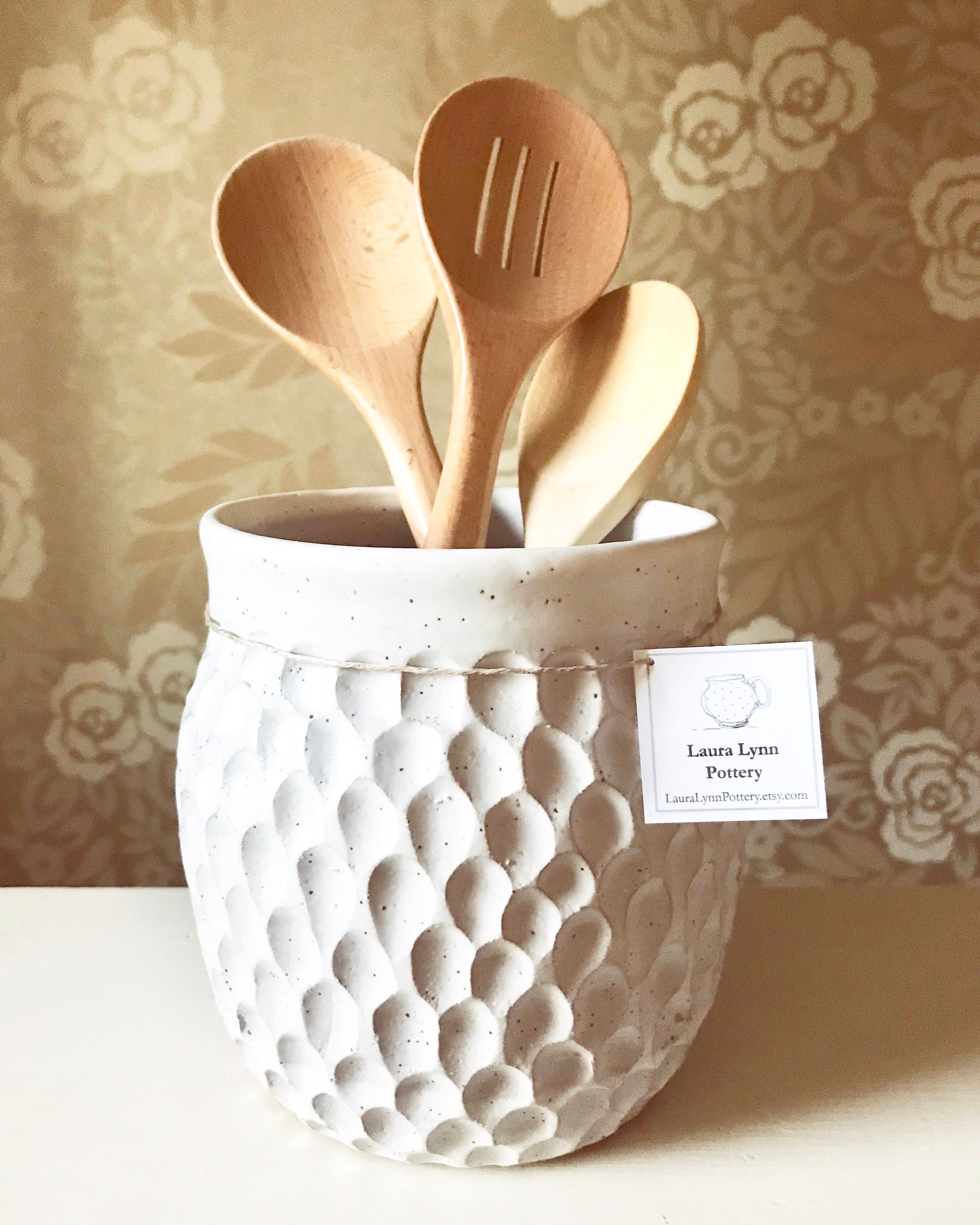 "This large handmade ceramic kitchen utensil holder is sure to add textural and visual interest to any space in your home. With its classy speckled white finish and dramatic earthy texture, the vase reflects a versatile style that matches modern, boho, traditional, earthy, etc. The jar was handmade on the pottery wheel, then texturized by hand carving the pattern and glazed with a classic speckled white. Made of durable stoneware clay. This item is dishwasher, and microwave safe. Approximately 6 Pottery Handbuilding, Ceramics Ideas Pottery, Diy Pottery, Hand Built Pottery, Ceramics Projects, Pottery Vase, Handmade Pottery, Ceramic Pottery, Ceramic Art