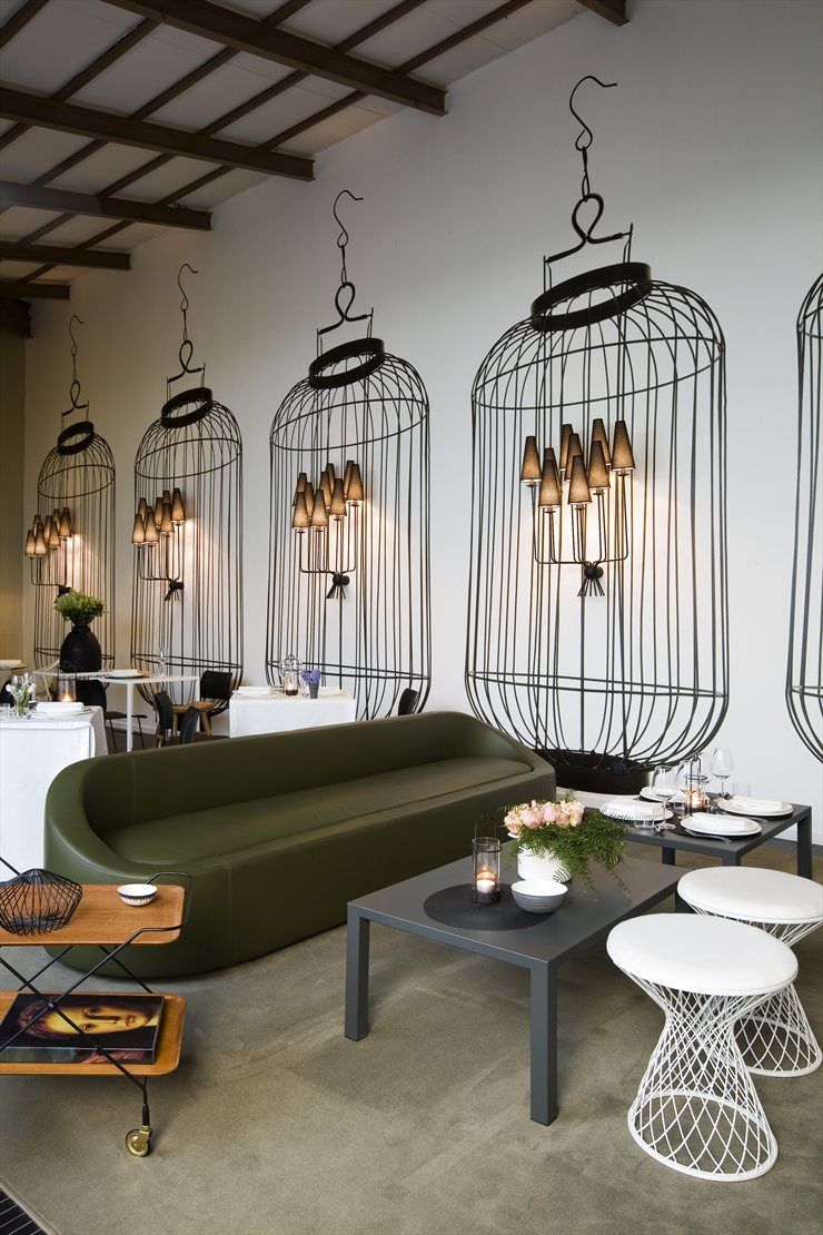 Home delicate restaurant milano 2008 how cool with the painted bird cages around the sconces