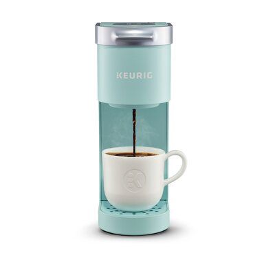 The Keurig K-Mini Single Cup Coffee Maker features a new sleek design, and at less than 5" wide is the perfect size for any space or occasion. The brewer is effortlessly simple to use add fresh water to the reservoir, pop in your favorite pod, press the brew button and enjoy fresh-brewed, delicious coffee in minutes. With a single cup reservoir and cord storage, the coffee maker is a portable brewer that makes anywhere perfect for great coffee. Color: Oasis | Keurig K-Mini Single Serve K-Cup Pod Single Cup Coffee Maker, Pod Coffee Makers, Keurig Coffee Makers, Espresso Makers, Single Serve Coffee Makers, Coffee Brewer, Coffee Pods, Drip Coffee Maker, Coffee Tea