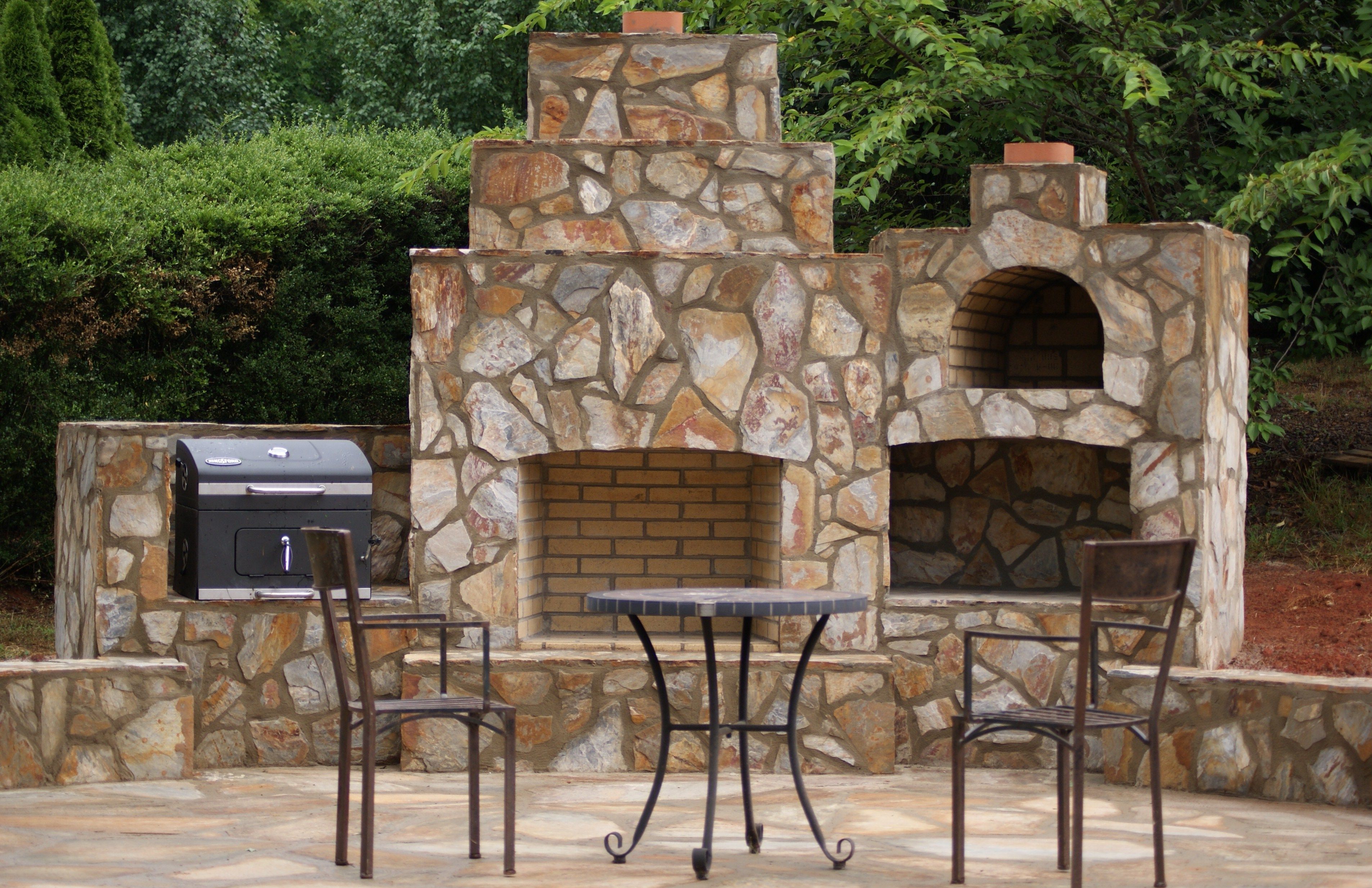 Hey Ya'll! This beautiful Outdoor Fireplace, Pizza Oven and Meat Smoker