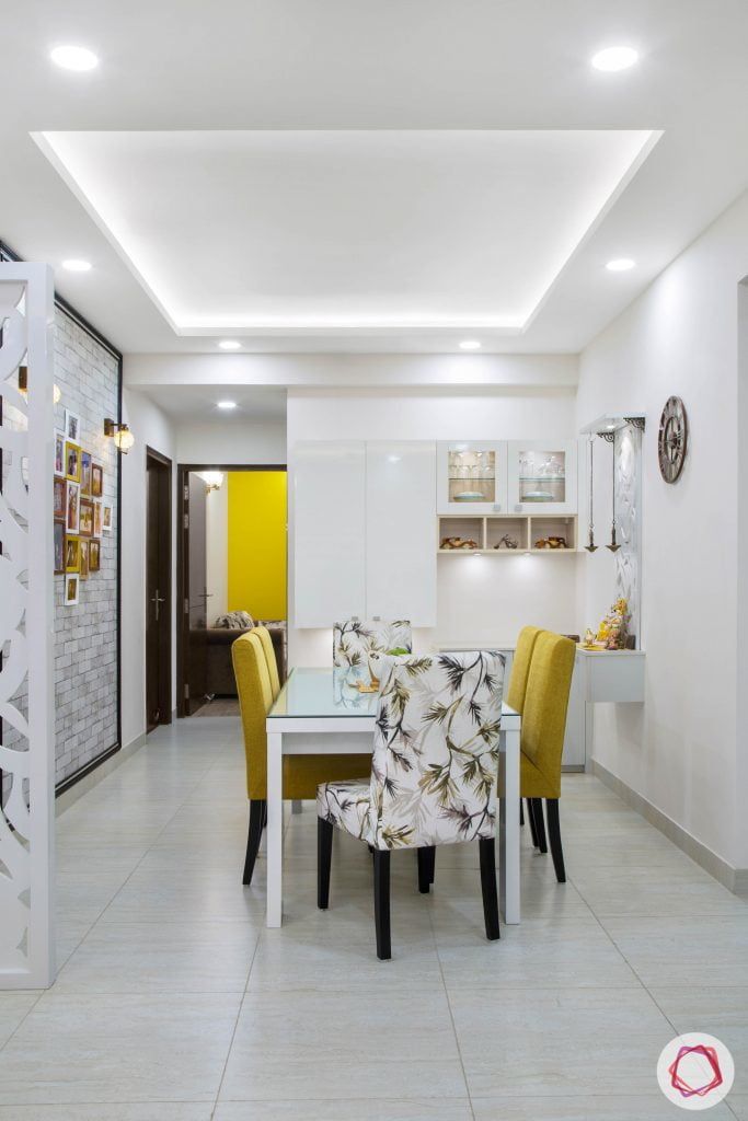Cleo county noida_dining room with mustard yellow chairs and white crockery unit Kitchen Ceiling Design, Simple False Ceiling Design, Interior Ceiling Design, House Ceiling Design, Ceiling Design Modern, Ceiling Design Living Room, Home Ceiling, Home Room Design, Dining Room Design