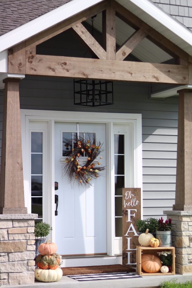 Our Fall front porch features modern pumpkins, an apple crate turned on it's side, an antique metal fishing bucket sprouting fall flowers, chippy classic urn planters, and small mums. I added a buffalo check mat in front of our welcome doormat and a twiggy fall wreath. My favorite addition is my "Oh, Hello Fall" sign. Small Front Porches, Front Porch Design, Fall Front Porch Decor, Porch Designs, Fall Porch, Rustic Front Porches, Narrow Front Porch Ideas, Modern Front Porch Ideas, House Porch Design