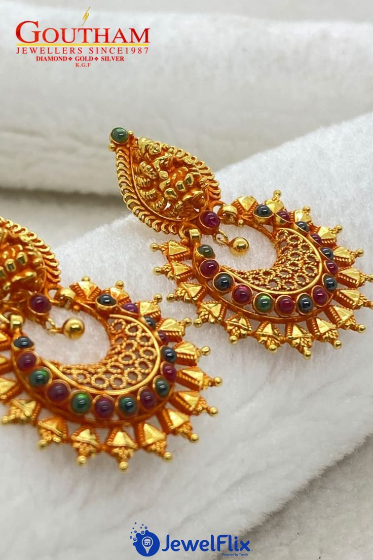 The gold earrings for any occasion. An ideal way to wear the most sparkling stones on your ears, along with the embellishment of our goddess Lakshmi. #earrings #goldearrings #ladiesearrings #stoneearrings #womensearrings #weddingjewellery Gold Earrings For Women, Long Gold Earrings, Gold Earrings Designs, Wedding Earrings, Wedding Jewelry, Jhumka Earrings, Stone Earrings, Women Of India, Earrings Collection