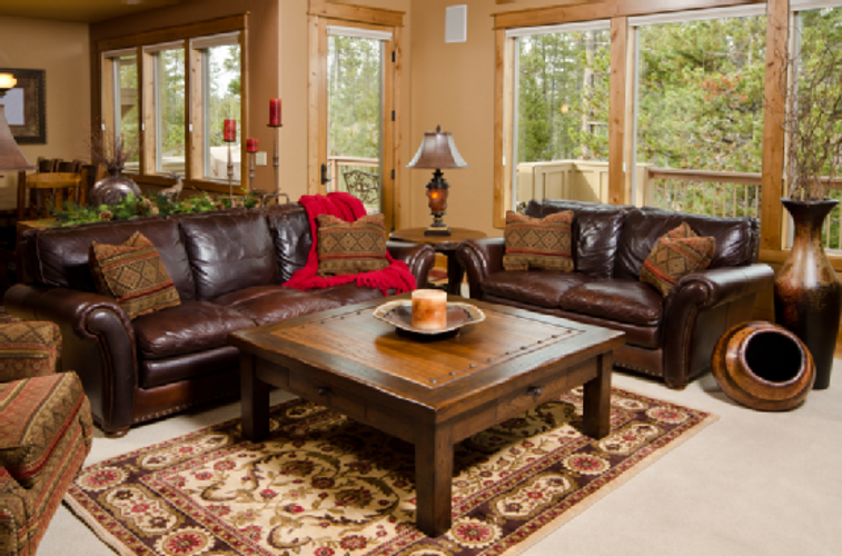 Living Room Cream Wall Dark Brown Leather Sofa Red Blanket Wooden Coffee Table Desk Living Room Cream Wall Dark Brown Leather Sofa Red Blanket Wooden Coffee Table Desk