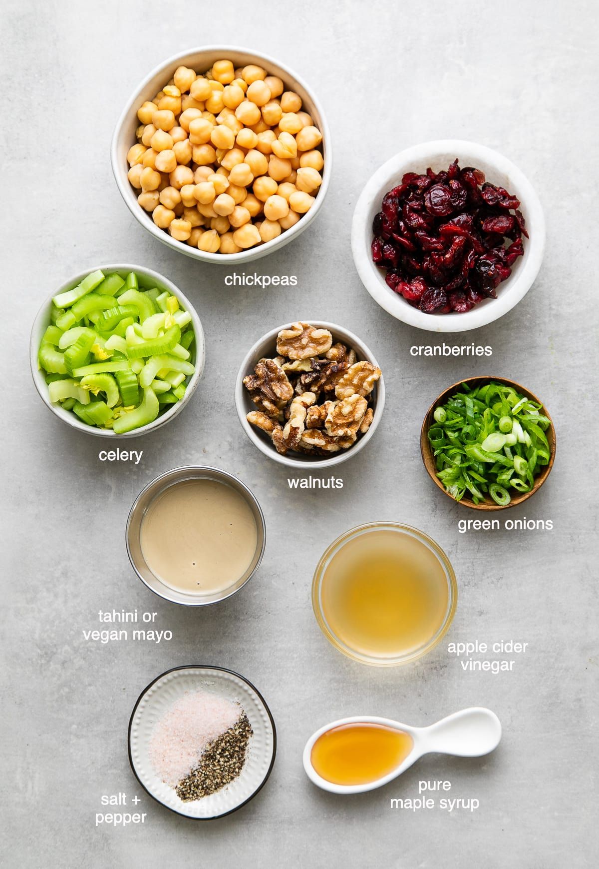 Vegan 'Chicken' Salad is a flavorful, quick and easy salad made with mashed chickpeas, cranberries and walnuts tossed with a creamy dressing for a healthy, WFPB wrap or sandwich filler! #chickpeas #healthyrecipes #veganrecipes #plantbased