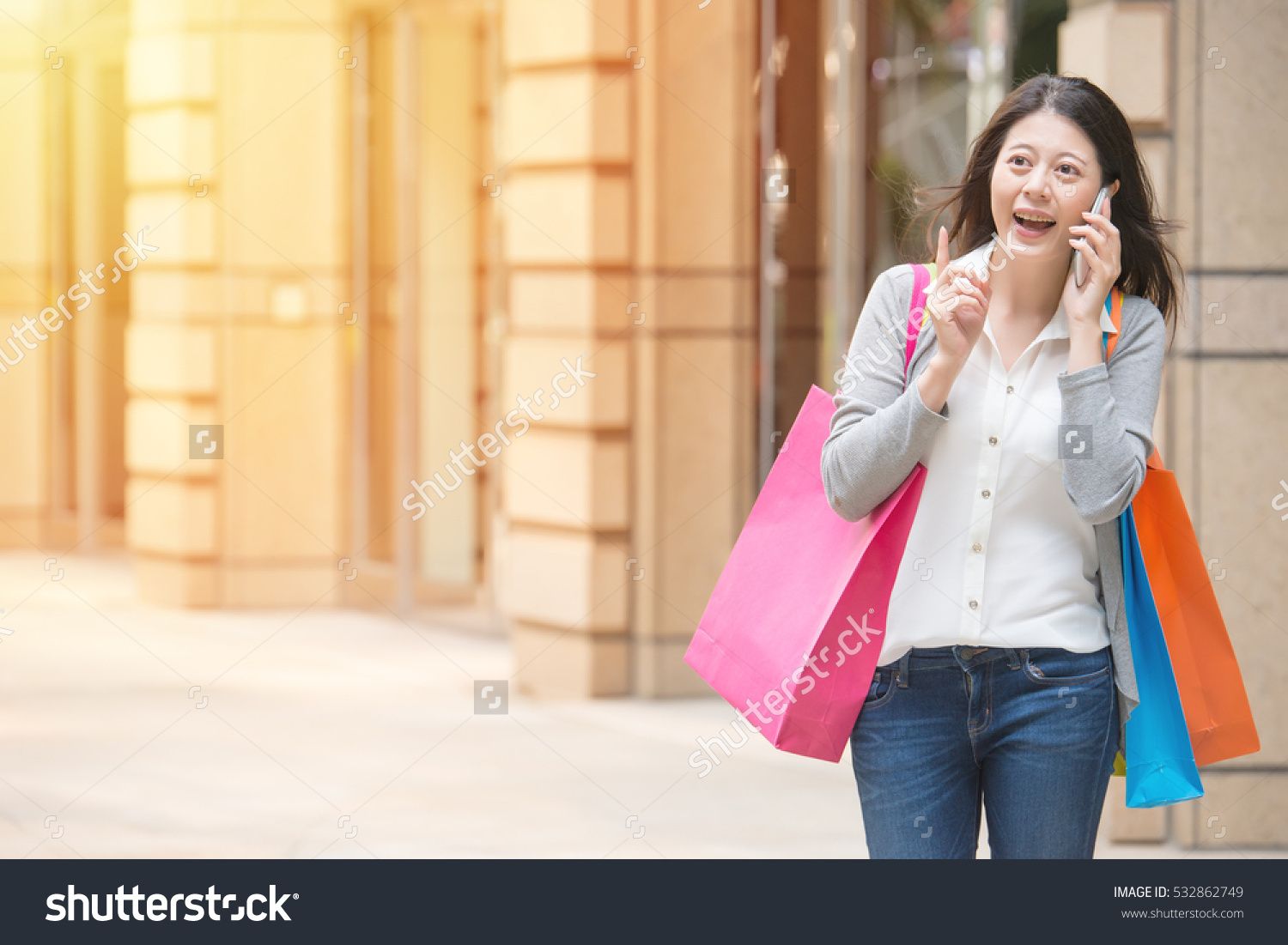 Smiling Happy Young Woman Shopping Talking On Mobile Phone