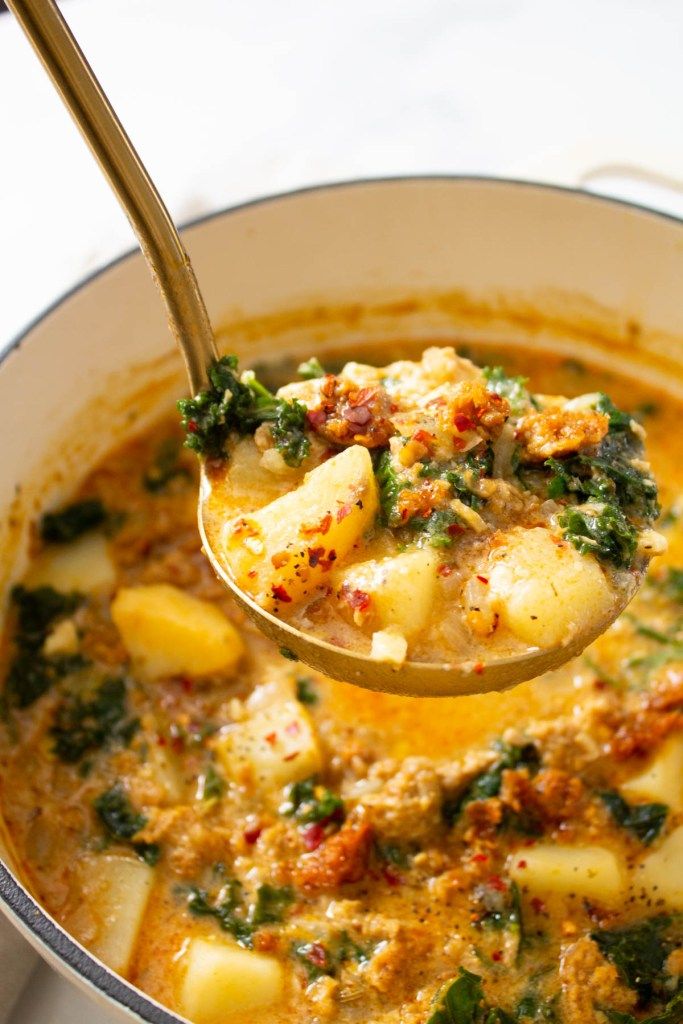 This Vegan Zuppa Toscana soup is perfectly creamy and comforting. Potatoes, vegan sausage and kale are loaded up in a super flavorful broth | ThisSavoryVegan.com #thissavoryvegan #vegansoup #zuppatoscana Savory Vegan, Vegan Soups, Vegetarian Vegan Recipes, Vegan Dinner Recipes, Vegan Cooking, Vegan Dishes, Veggie Recipes, Whole Food Recipes, Paleo