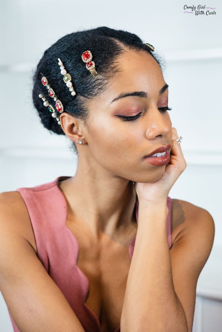 Holiday Party look and hairstyle inspiration for Black women | Natural hair slicked back into a bun with jewelled and pearl bobby pins embellishing it. Red and green gem stones are perfect for Christmas hair accessories Christmas Hair Accessories, Natural Hair Accessories, Holiday Hairstyles, Bride Hairstyles, Hair Jewerly, Natural Hair Bride, Brown Skin Makeup, Green Gem, Texturizer On Natural Hair