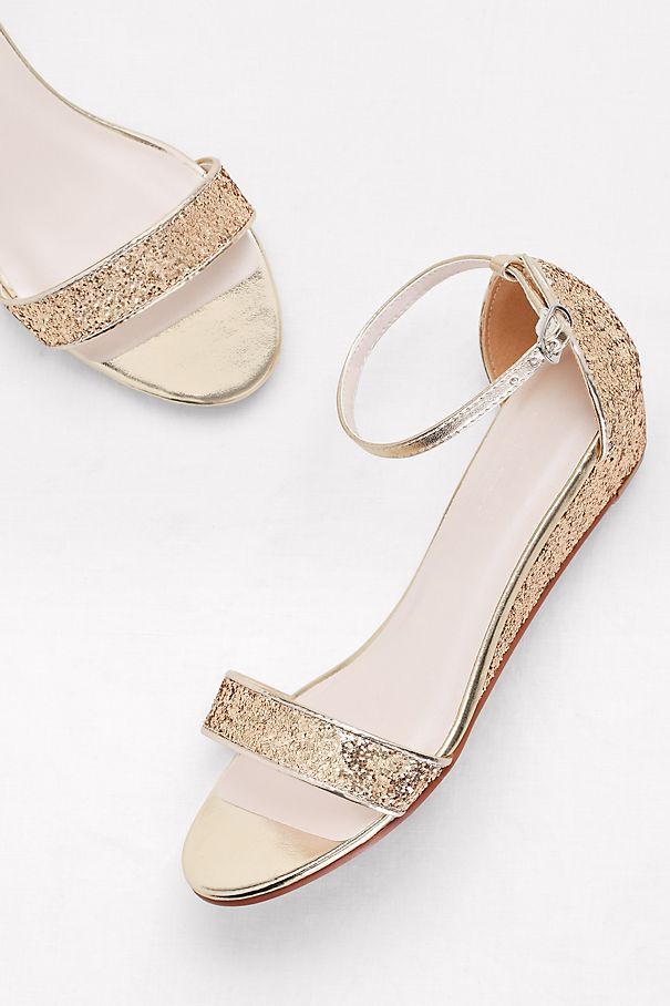 Add a festive feel to cropped trousers or midi-dresses with these textured glitter wedges. Synthetic 1.5 wedge Adjustable buckle Imported