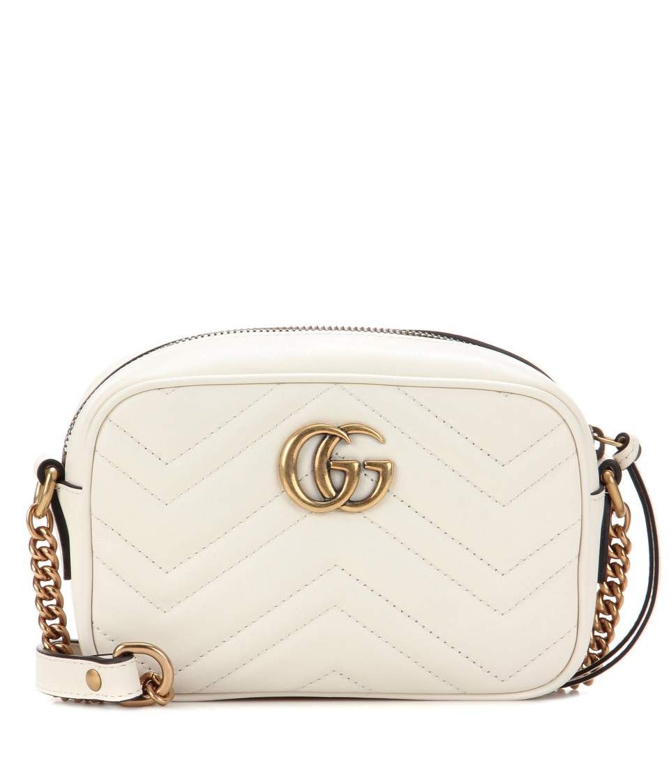 white gucci purse with heart on back