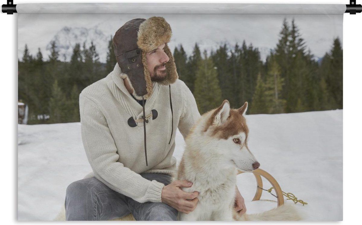 Een man zit op een slee en heeft een muts op. Naast hem zit een Siberische Husky. De man aait zijn hond. Deze afbeelding is een geschikt cadeau voor jezelf of iemand anders. Dit hippe wandkleed past bij elk interieur! Productinformatie✔ 98.9% van onze klanten is positief over 1001Tapestries!✔ Gemaakt van stevig en duurzaam materiaal✔ Leuk om aan je muur te hebben✔ Ideaal om je interieur van extra sfeer te voorzien✔ Scherpe afdruk met heldere kleuren✔ Inclusief ophangroedeOok op zoek naar een Dogs, Tapestry, Animals, Man, Products, Hanging Tapestry, Tapestries, Animales, Animaux