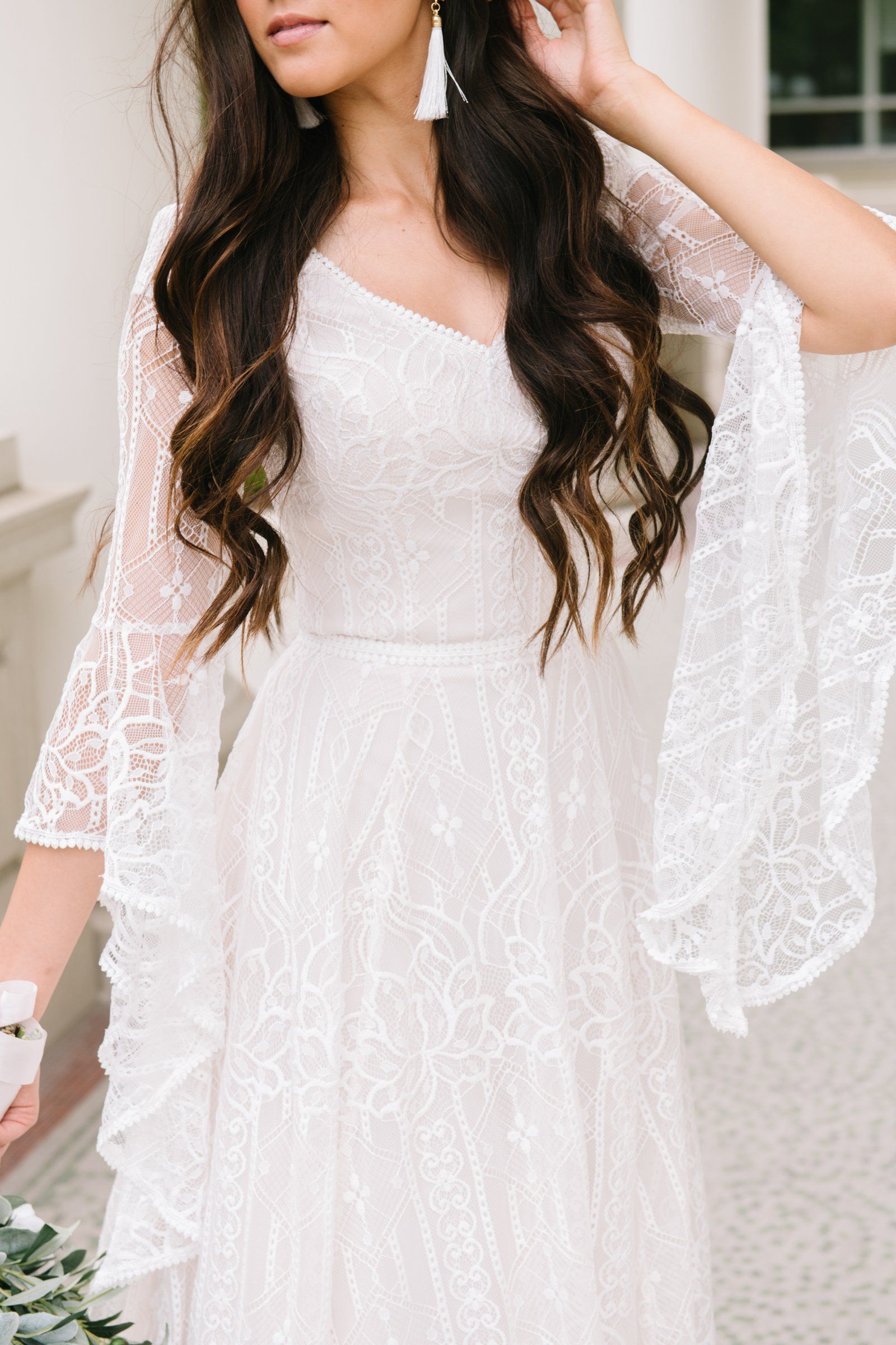 Bohemian beauties are you looking for a flowy bell sleeve? This V-neck is also for all of our classic brides wanting a lace gown. Style Love: This dress is part of our newer collection! We love this boho-chic, lace dress! Desert/Champagne/Ivory sample available in the store. (Pictured) Plus size available in store. Ne Medieval Wedding Dress, Medieval Gown, Boho Wedding Dress, Bell Sleeve Wedding Dress, Woodland Wedding Dress, Elvish Wedding, Boho Wedding Bridesmaids, Bell Sleeve Dress, Wedding Attire