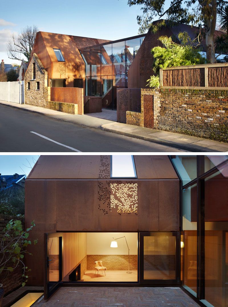 This home built behind a 19th century stable wall has a modern look to it created by the use of large glass panels and perforated weathering steel