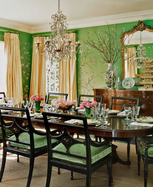 a formal dining room with green walls and floral wallpaper, including ...