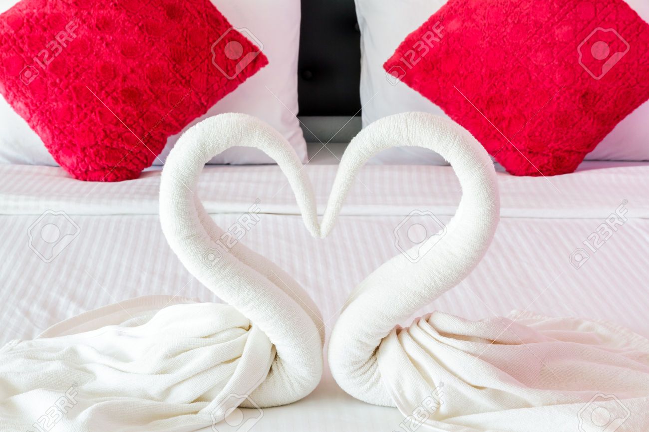 Towels Shaped Swans Heart On Bed In Room Hotel Heart Decorations Hotels Room Shapes
